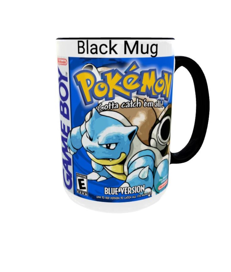 May include: A black ceramic mug featuring a graphic print of the Pok&eacute;mon Blue Version Game Boy game cover. The design includes the Pok&eacute;mon logo, the text Gotta catch 'em all!, Blastoise, the Game Boy logo, and the ESRB E rating symbol.