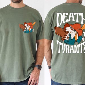 a man wearing a t - shirt with a cartoon character on it