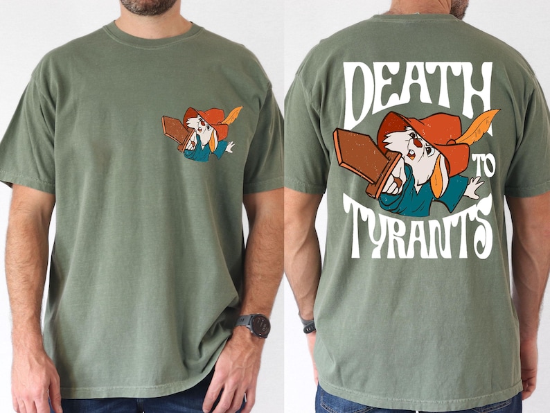 a man wearing a t - shirt with a cartoon character on it