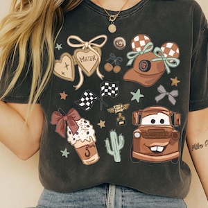 a woman wearing a black tshirt with cars on it