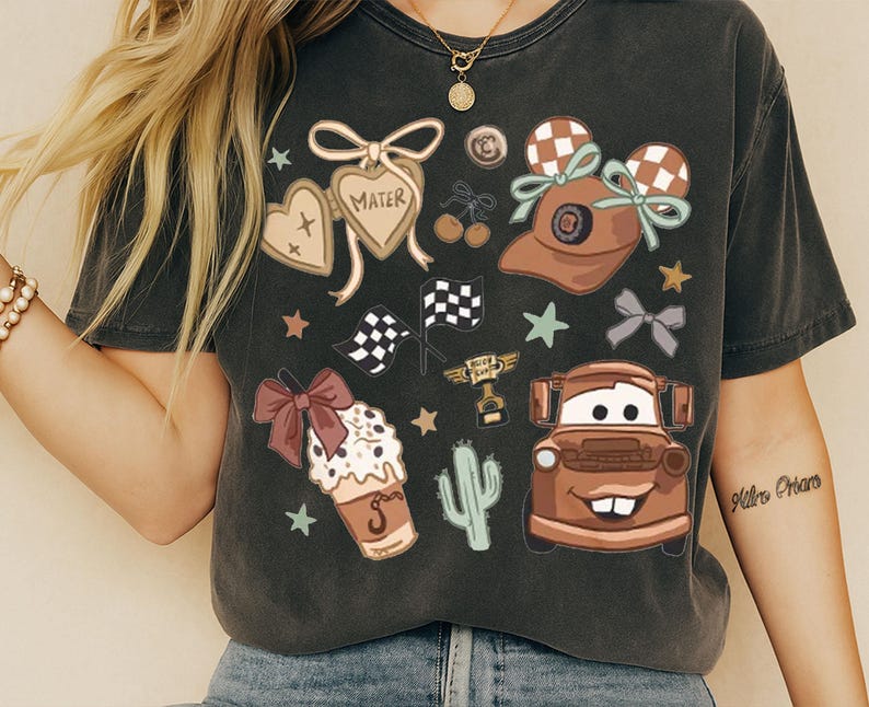 a woman wearing a black tshirt with cars on it