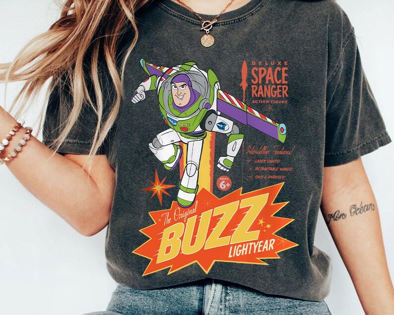 a woman wearing a buzz lightyear space ranger t - shirt