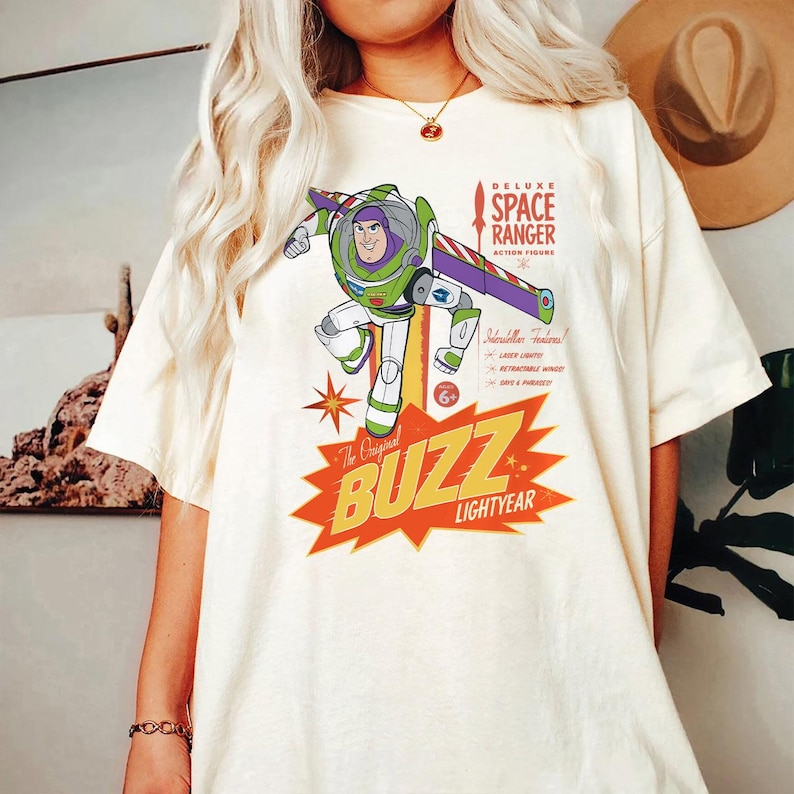 a woman wearing a buzz lightyear t - shirt