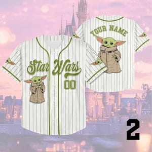 A white baseball jersey with a Star Wars character printed on it, featuring a castle in the background. The jersey has a personalized name and number on the back.
