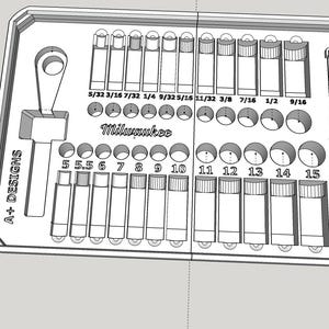 May include: A white plastic storage tray with slots for holding various sizes of drill bits. The tray is labelled with the sizes of the drill bits in inches, including 5/32, 3/16, 7/32, 1/4, 9/32, 5/16, 11/32, 3/8, 7/16, 1/2, and 9/16. The tray also has slots for holding drill bits sized 5, 5.5, 6, 7, 8, 9, 10, 11, 12, 13, 14, and 15. The tray is labelled "Milwaukee" and "A+ DESIGNS".