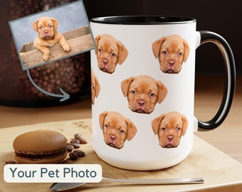 May include: White ceramic coffee mug with a black rim and handle. The mug features a repeated pattern of a brown and white puppy's face. The text "Your Pet Photo" is printed below the mug.
