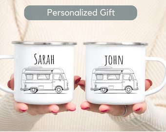 May include: Two white enamel mugs with black outlines of a camper van and the names "SARAH" and "JOHN" printed on them.
