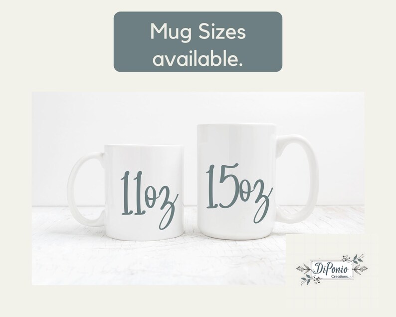 May include: Two white ceramic mugs, one labeled "11oz" and the other "15oz" in a script font. The text "Mug Sizes available" is at the top. The mugs are on a white surface.