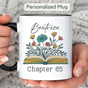 May include: White ceramic mug with a black handle and interior. The mug features the text "Personalized Mug" at the top, the name "Beatrice" in script, and "Chapter 65" at the bottom. A floral design with yellow, teal, and orange flowers is in the center.