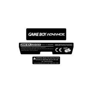 May include: Black and white labels for a Game Boy Advance. The labels include the text "GAME BOY ADVANCE", model information, and a warning to read the instruction booklet. The labels also include the CE and GS marks.