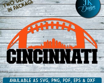 May include: A digital design featuring an orange football helmet with a skyline of Cincinnati, Ohio inside. The text "CINCINNATI" is in black below the helmet. The text "TWO DESIGNS IN PACKAGE" is in the top left corner. The text "AVAILABLE AS SVG, PNG, PDF, EPS & DXF" is at the bottom of the image.