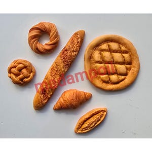 Miniature French baguette/sorts of bread magnet made of clay
