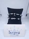 Set of elastic pearl bracelets with charm (black/white/silver theme) - CYRIELLE model product logo