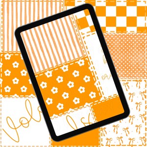 May include: A black tablet displaying a patchwork design in orange and white. The design includes stripes, floral patterns, and text. The overall aesthetic is bright and cheerful, with a handmade or digital art feel.