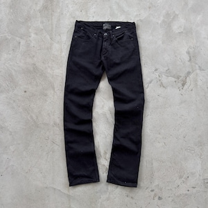 May include: A pair of black denim jeans. The jeans have a classic five-pocket design, a button and zipper closure, and a straight leg fit. The jeans are made of a sturdy, dark-colored denim material.