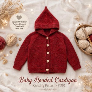 May include: A deep red knitted baby cardigan with a pointed hood and five light-colored heart-shaped buttons down the front. The text on the image reads: Digital PDF Pattern Pattern | Instant Download | With love Baby Hooded Cardigan Knitting Pattern (PDF).