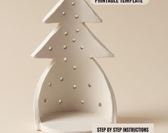 Puede incluir: Decoración blanca de cerámica con forma de árbol de Navidad, con interior hueco y pequeños recortes circulares. El texto "PRINTABLE TEMPLATE" y "STEP BY STEP INSTRUCTIONS PDF INSTANT DOWNLOAD" son visibles.