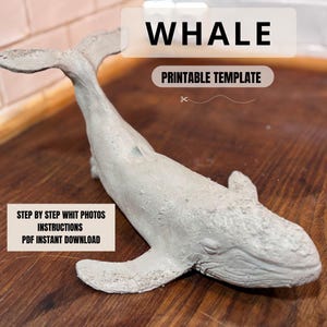 Puede incluir: Una escultura de ballena gris claro con la palabra "WHALE" encima. El texto "PRINTABLE TEMPLATE" está debajo de la palabra "WHALE". El texto "STEP BY STEP WHIT PHOTOS INSTRUCTIONS PDF INSTANT DOWNLOAD" está debajo de la ballena.
