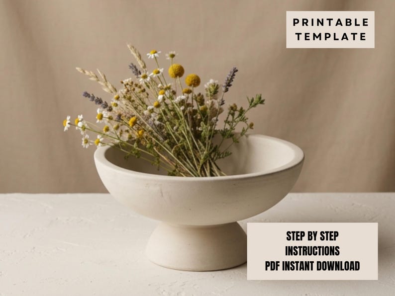 a white ceramic bowl filled with a bouquet of dried flowers, placed on a white surface.