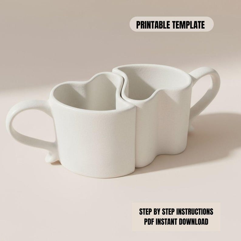 May include: Two white ceramic mugs designed to fit together, forming a heart shape. Each mug has a handle and a unique wavy top edge. The text "PRINTABLE TEMPLATE" and "STEP BY STEP INSTRUCTIONS PDF INSTANT DOWNLOAD" are visible.