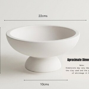 a white ceramic bowl with measurements and text indicating the dimensions of the bowl.