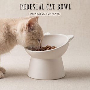 May include: A white pedestal cat bowl with a cat eating from it. The bowl has a wide, angled opening and a rounded base. The text "PEDESTAL CAT BOWL" and "PRINTABLE TEMPLATE" are at the top of the image.