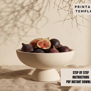 a white bowl filled with sliced figs, placed on a wooden surface.