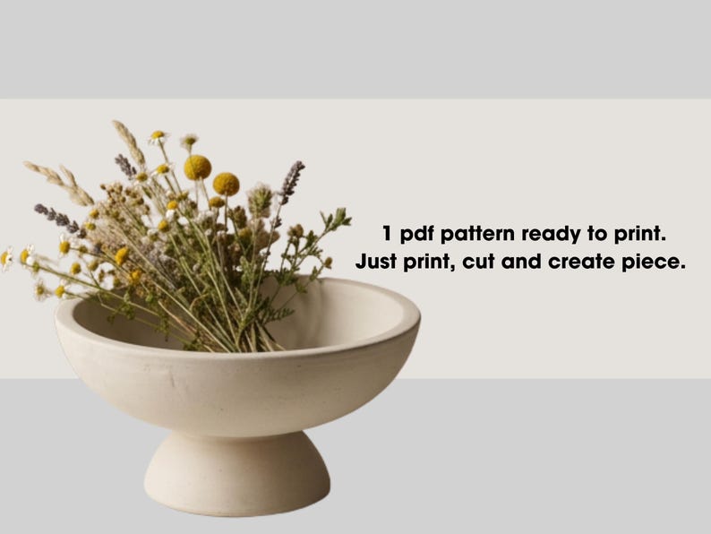 a white ceramic bowl filled with a variety of dried flowers, including yellow and purple blooms, placed on a white surface.