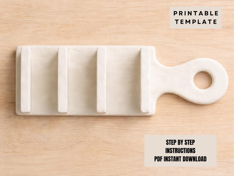 May include: Cream-coloured soap dish with a handle and three raised bars. The dish is rectangular with a rounded handle featuring a circular opening. The text "PRINTABLE TEMPLATE" and "STEP BY STEP INSTRUCTIONS PDF INSTANT DOWNLOAD" are visible.