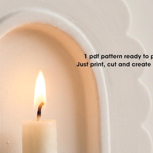A lit candle in a white archway, with text overlaid that reads "1 PDF pattern ready to print. Just print, cut and create piece."