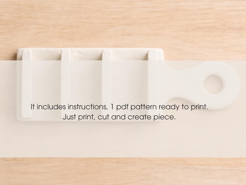 May include: A white, rectangular craft tool with a handle and a circular opening. The tool has multiple compartments. Text on the image reads: "It includes instructions, 1 pdf pattern ready to print. Just print, cut and create piece."