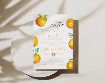 May include: A gender reveal invitation featuring watercolor oranges and green leaves. The text reads "A Little Cutie is on the Way!" with details for Catherine & Miles' event on April 28th at 3:00 PM.