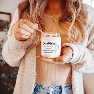 May include: A white soy wax candle with the text "CeraWicks Soy Wax Candle 9 oz / 255 g Thank you for supporting our small business" on the label.