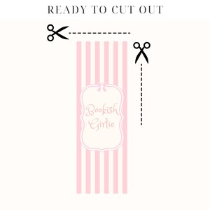 May include: Printable cut-out bookmark with pink and white stripes and a white frame with the text "Bookish Girlie" in pink script.