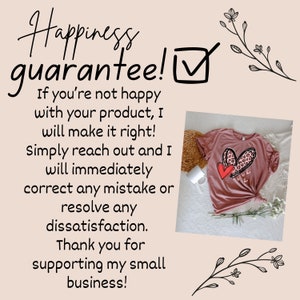 May include: A pink t-shirt with a graphic of two red hearts, one with a leopard print, and the text "Love You" in white. The text "Happiness guarantee!" is written in black with a checkmark in a box. The text below reads "If you're not happy with your product, I will make it right! Simply reach out and I will immediately correct any mistake or resolve any dissatisfaction. Thank you for supporting my small business!"
