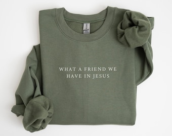 May include: A green sweatshirt with the text "What a friend we have in Jesus" printed on the front.