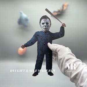 May include: A papercraft figure of Michael Myers from the Halloween franchise. He is wearing a blue jumpsuit and a white mask. He is holding a baseball bat in his right hand. The figure is designed to be a DIY craft project. The text "DIY GIFT & SELF MADE FUN" is printed below the figure.