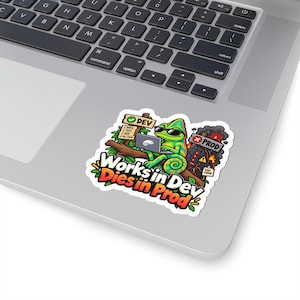 May include: A sticker featuring a green chameleon wearing sunglasses, sitting on a branch while using a laptop. A sign labeled DEV shows a checklist, while a smoking, burning building labeled PROD displays a 500 error. Text reads Works in Dev Dies in Prod.