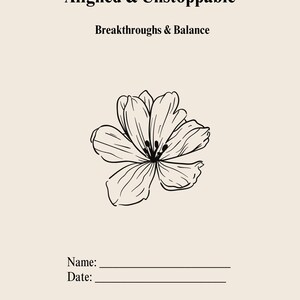 May include: A journal with the text "Aligned & Unstoppable" and "Breakthroughs & Balance" at the top. A black and white floral illustration is centered below the text. The bottom of the journal has lines for "Name:" and "Date:"