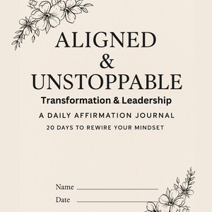 May include: A beige affirmation journal with black text that reads "ALIGNED & UNSTOPPABLE". The journal includes the text "Transformation & Leadership" and "A DAILY AFFIRMATION JOURNAL". Floral line art accents the corners. Includes space for name and date.