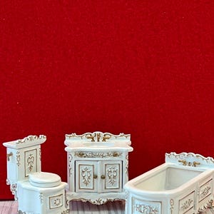 A beautiful half scale vintage inspired bathroom. The set includes a tub, vanity and a toilet.
