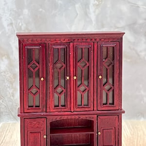 1/2 scale Mahogany Glass front China Cabinet with 2 shelves on the bottom and 2 closed door cabinets.