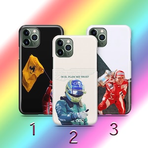 May include: Three different phone cases with different designs. The first case has a black background with a green and yellow flag. The second case has a white background with a racing driver wearing a blue and green helmet. The third case has a white background with a racing driver wearing a red racing suit.