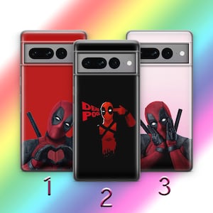 May include: Three phone cases with different Deadpool designs. The first case is red with Deadpool making a heart shape with his hands. The second case is black with Deadpool pointing a gun to his head and the text "DEADPOOL". The third case is pink with Deadpool covering his eyes with his hands.