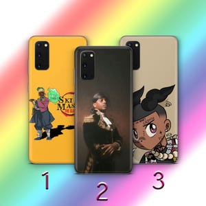 May include: Three different phone cases with various designs. The first case is yellow with a cartoon character and the text "Ski Mask The Slump God". The second case is black with a portrait of a person wearing a military uniform. The third case is beige with a cartoon character with a red and blue design and the text "I was born to sacrifice".