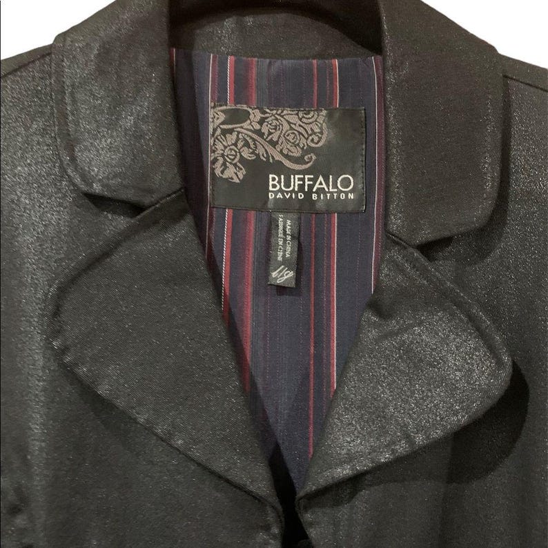 May include: A black jacket with a textured finish. The interior lining features a striped pattern in navy, red, and white. The label reads "BUFFALO DAVID BITTON."