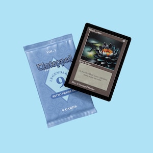 May include: A collectible card displaying a black lotus flower with orange highlights, labelled "Black Lotus" and "Mono Artifact." Next to it is a light blue sealed pack of "Untapped Legendary" cards, "Retro Frame Set," containing 9 cards.