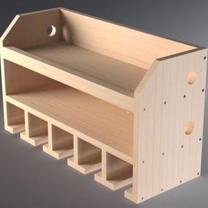 May include: A wooden wall-mounted shelf with six compartments for storing items. The shelf has a top shelf and a bottom shelf with a decorative cutout on the front.