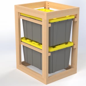 May include: A wooden storage unit with two gray plastic bins and yellow lids. The bins are stacked inside a light-colored wooden frame, designed for organization and storage. The unit is ideal for a garage or workshop.