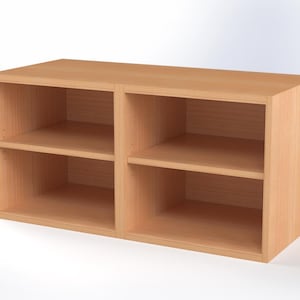 May include: A light brown wooden storage unit with two sections, each containing a shelf. The unit is rectangular and has a simple, modern design. The wood grain is visible, giving it a natural look. Suitable for storing books, ornaments, or other items.
